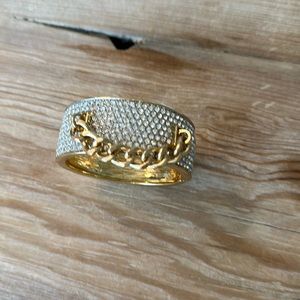 Costume gold, toned bangle bracelet with rhinestone embellishment and gold chain